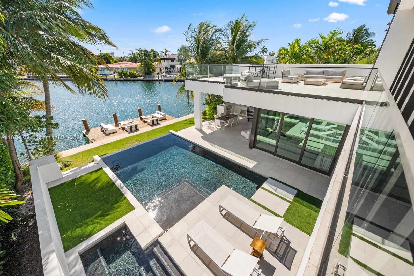 1413 Biscaya Drive Surfside, FL 33154 - Photo 5 of 35 a view of a chairs and table in patio