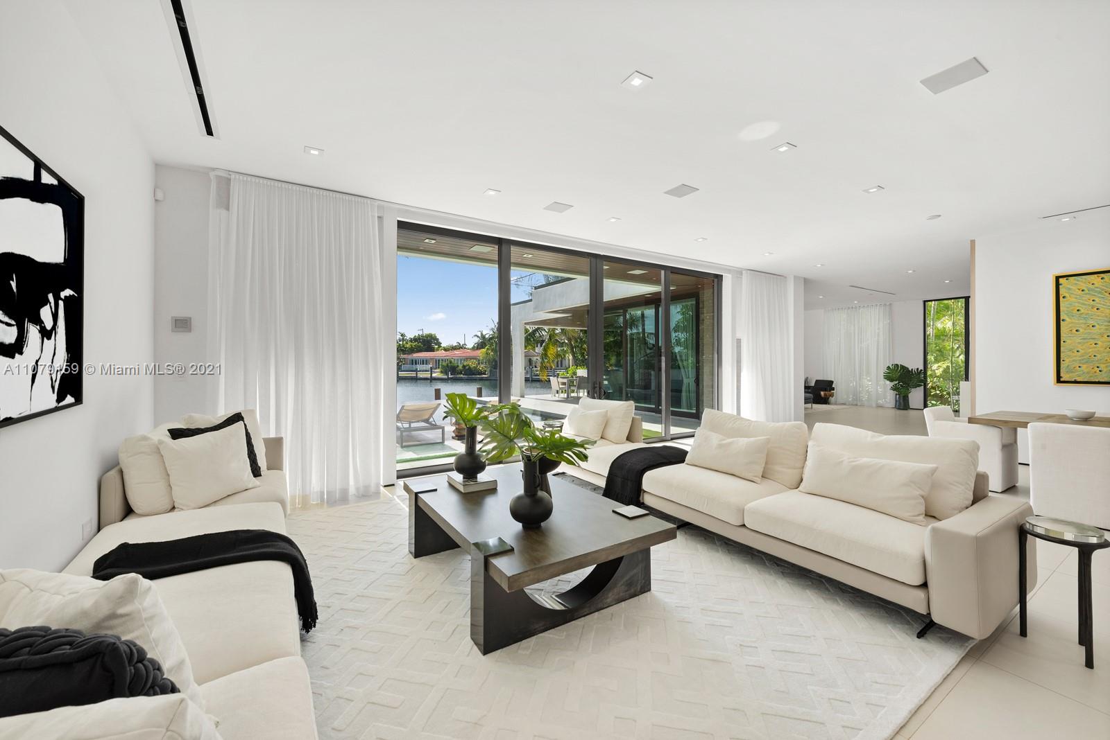 1413 Biscaya Drive Surfside, FL 33154 - Photo 6 of 35 a living room with furniture and a large window