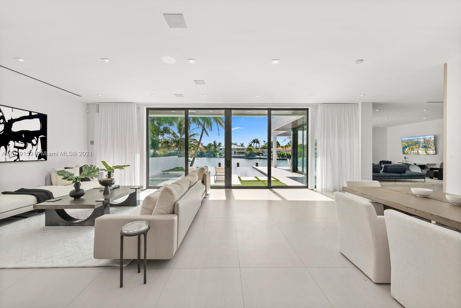 1413 Biscaya Drive Surfside, FL 33154 - Photo 7 of 35 a living room with furniture and a large window