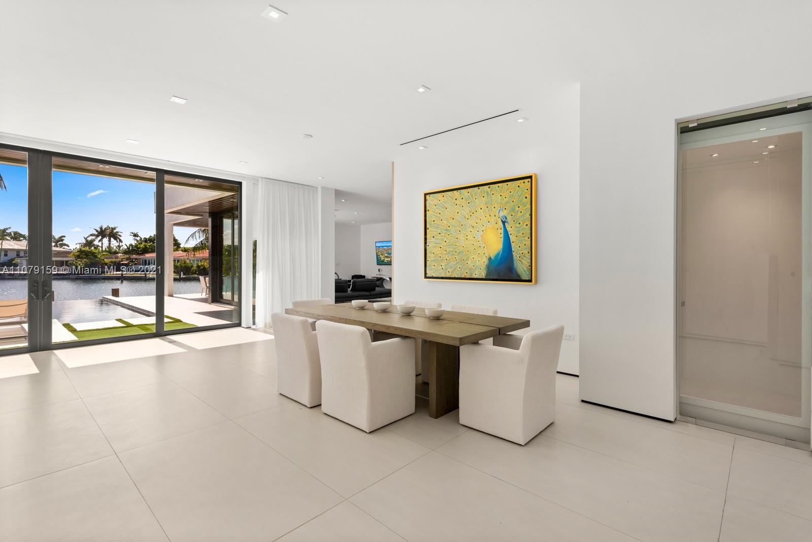 1413 Biscaya Drive Surfside, FL 33154 - Photo 8 of 35 a view of a kitchen with a sink and a refrigerator