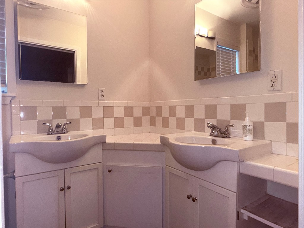 5413 Coventry Lane Austin, TX 78723 - Photo 13 of 25 a kitchen with sink a microwave and cabinets