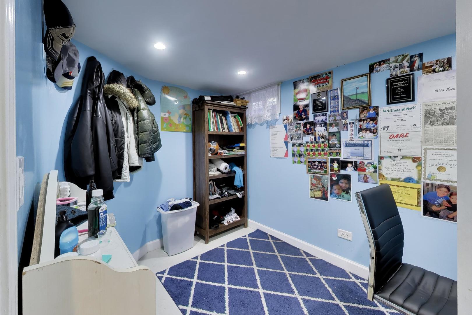 458 West Alma Street Elmhurst, IL 60126 - Photo 22 of 29 a view of walk in closet with clothes and shoes