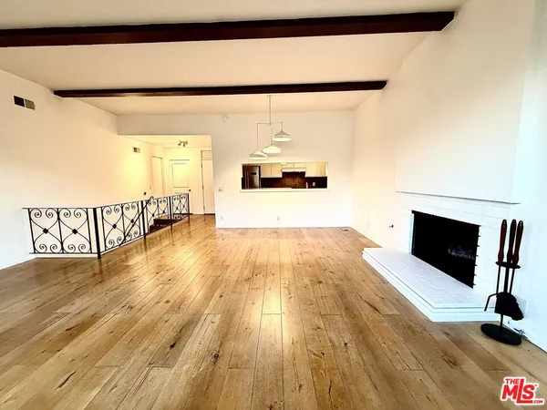 a living room with furniture fireplace and flat screen tv