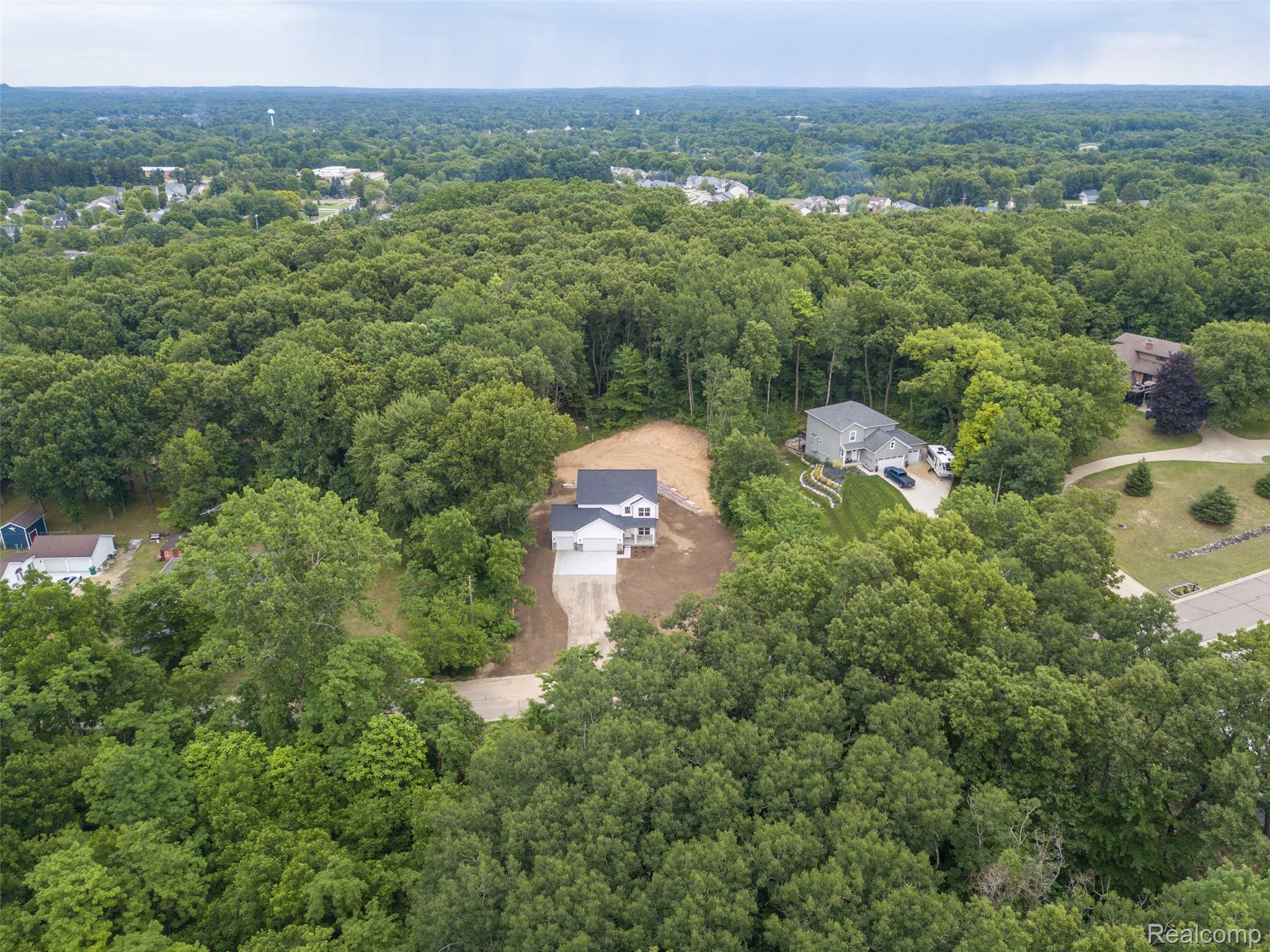 16085 Catalpa Ridge Holly, MI 48442 - Photo 32 of 40 New construction residence situated on a cleared parcel amidst mature trees