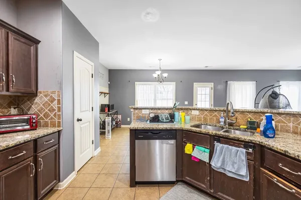 a kitchen with lots of counter top space and stainless steel appliances
