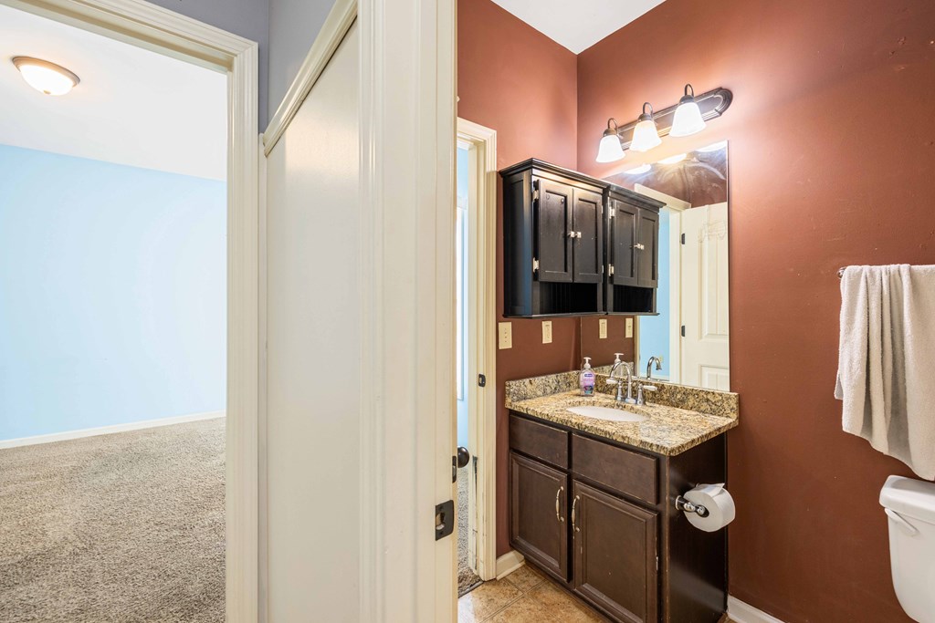 4936 Brightstar Lane Columbus, GA 31907 - Photo 15 of 42 a bathroom with a sink and a mirror