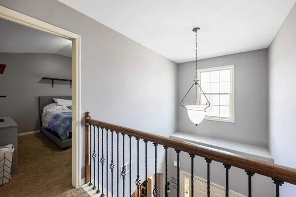 a bedroom with bed and a window