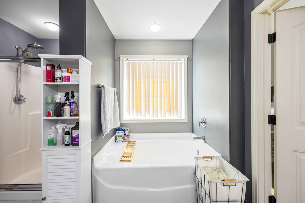 4936 Brightstar Lane Columbus, GA 31907 - Photo 28 of 42 a bathroom with a tub sink and a window