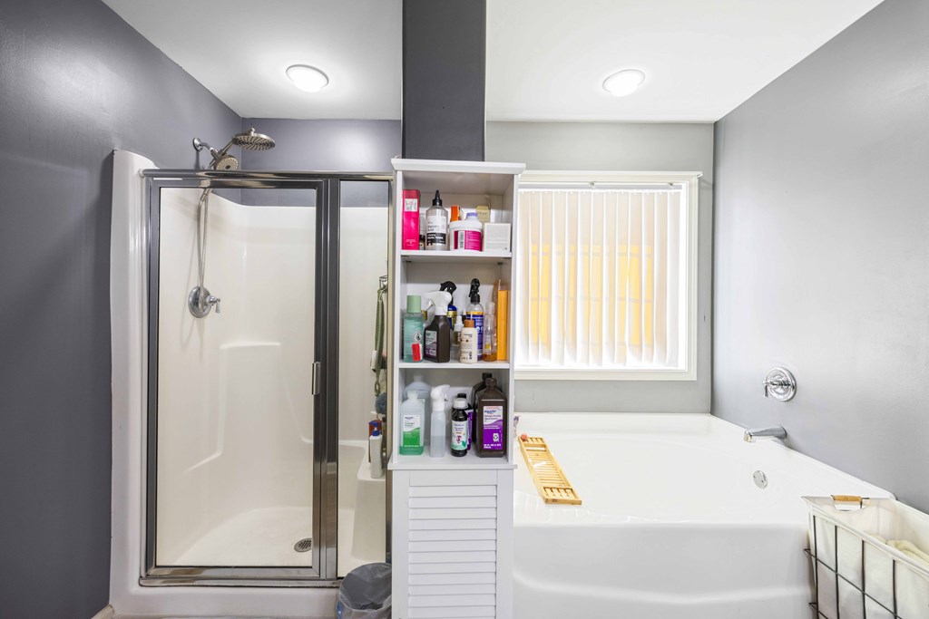 4936 Brightstar Lane Columbus, GA 31907 - Photo 29 of 42 a bathroom with a bathtub and a shower