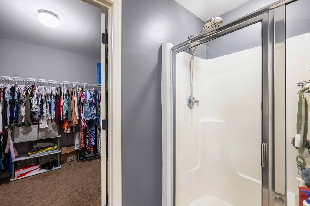 4936 Brightstar Lane Columbus, GA 31907 - Photo 30 of 42 a view of walk in closet with clothes