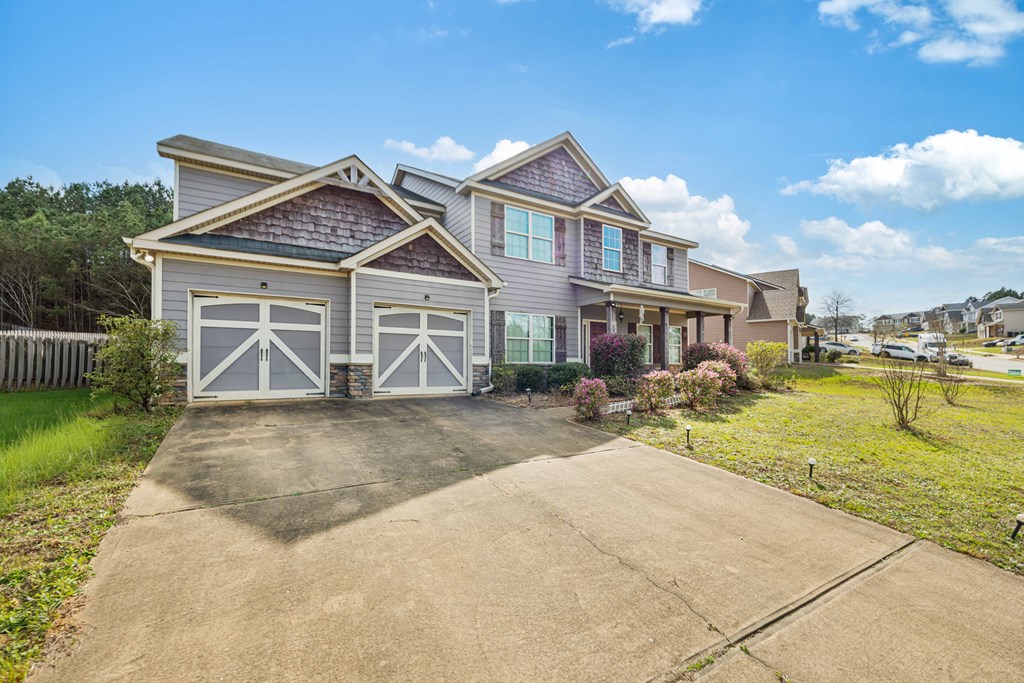 4936 Brightstar Lane Columbus, GA 31907 - Photo 3 of 42 a front view of a house with garden