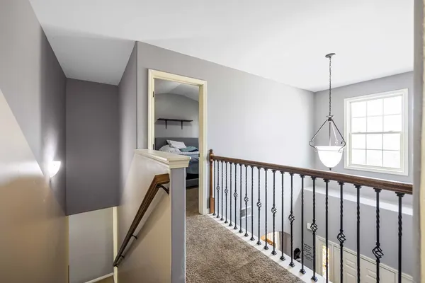 a view of a hallway with windows