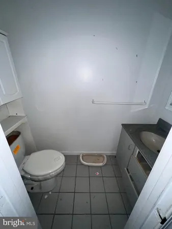 a kitchen with white cabinets appliances and a sink
