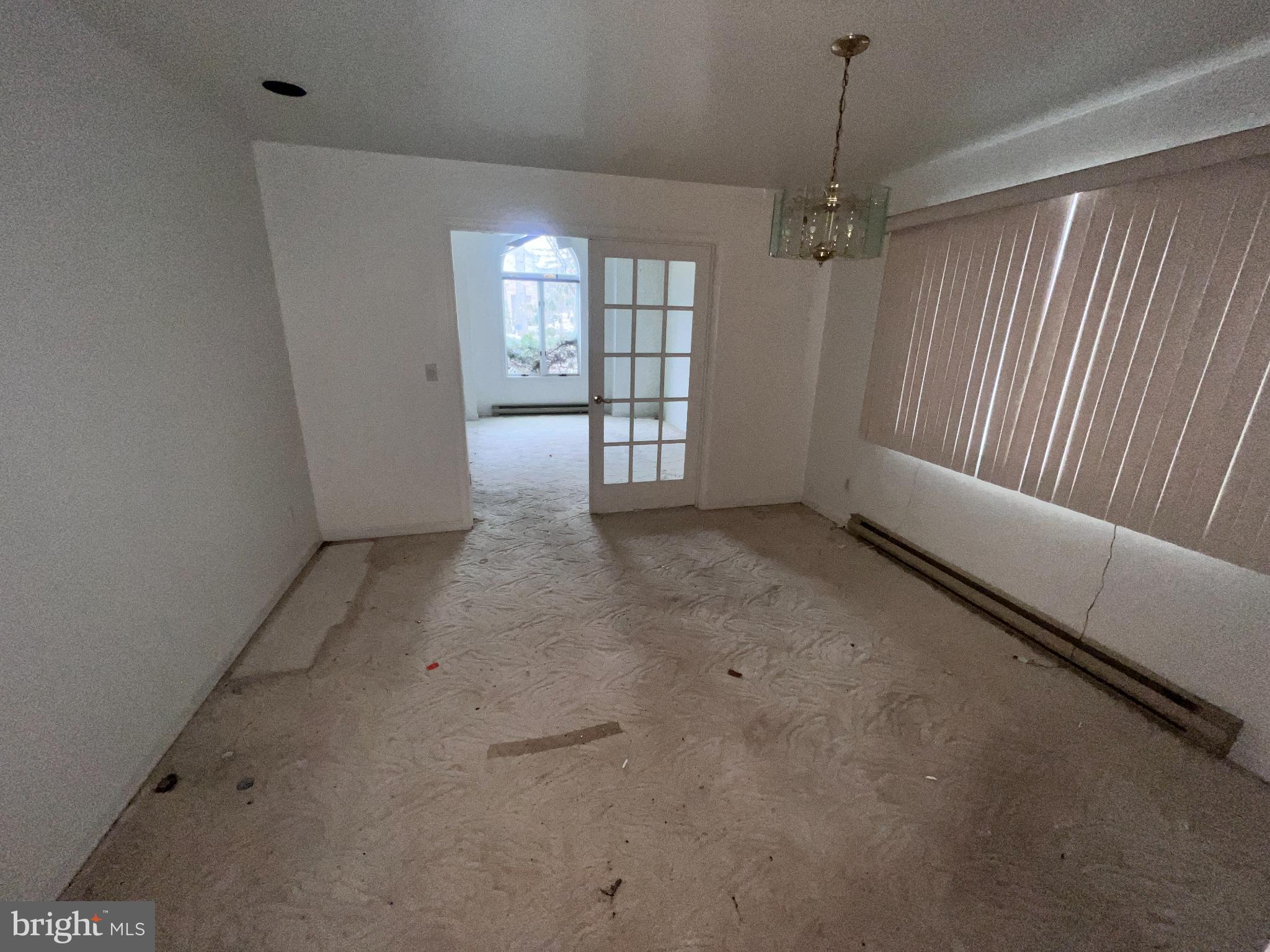 198 Pysell Road McHenry, MD 21541 - Photo 22 of 47 an empty room with chandelier fan and windows