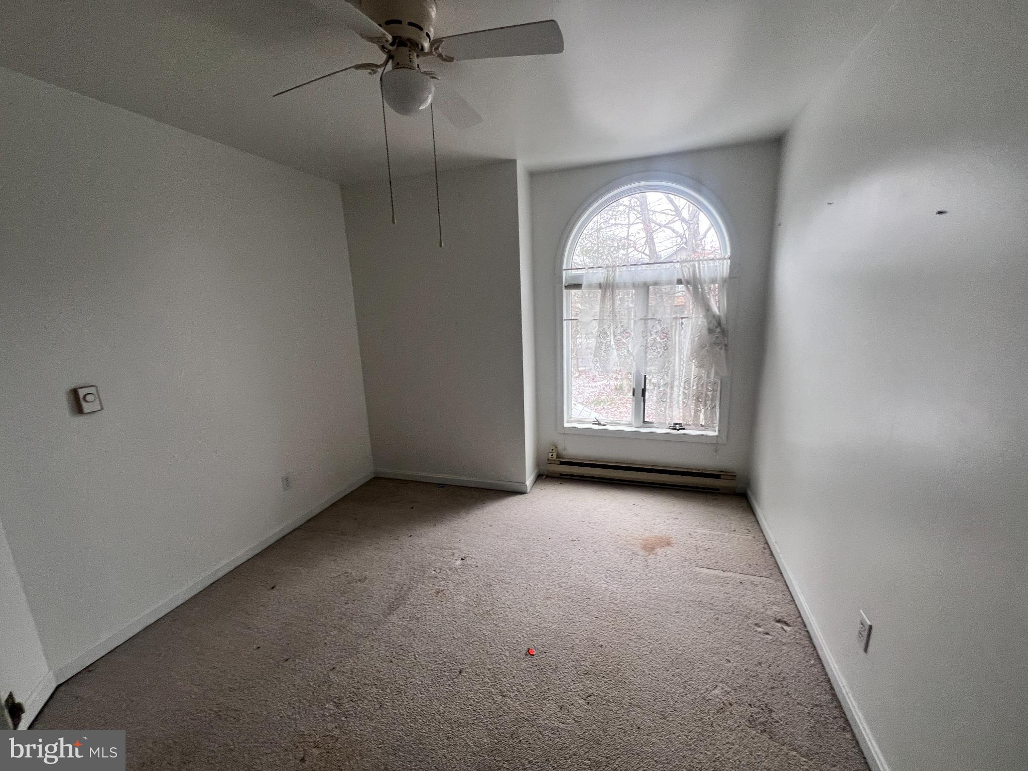 198 Pysell Road McHenry, MD 21541 - Photo 29 of 47 an empty room with a window and a mirror