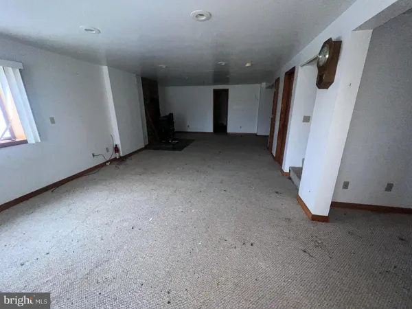 a view of a house with a yard and garage