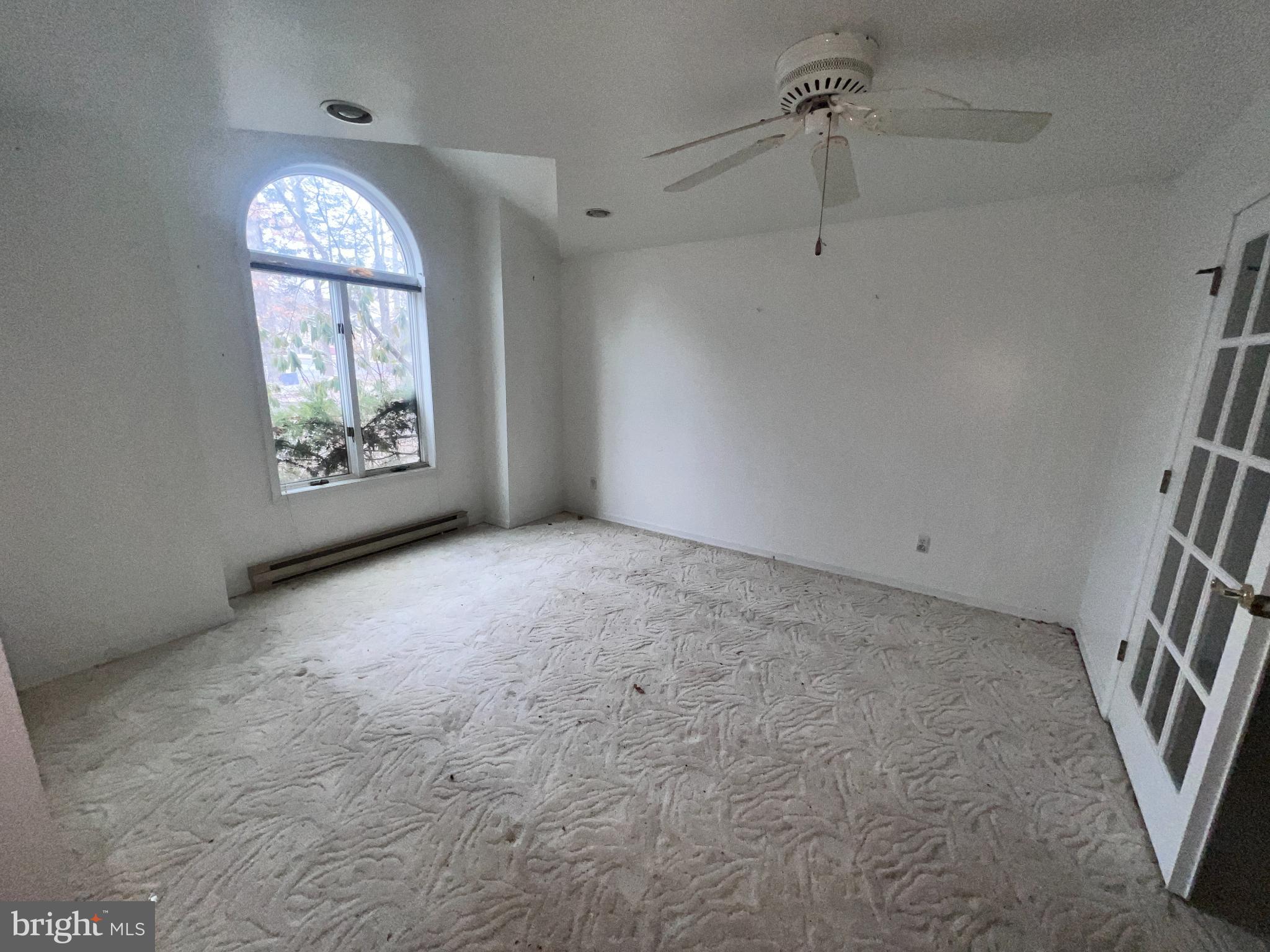 198 Pysell Road McHenry, MD 21541 - Photo 4 of 47 an empty room with windows and entrance