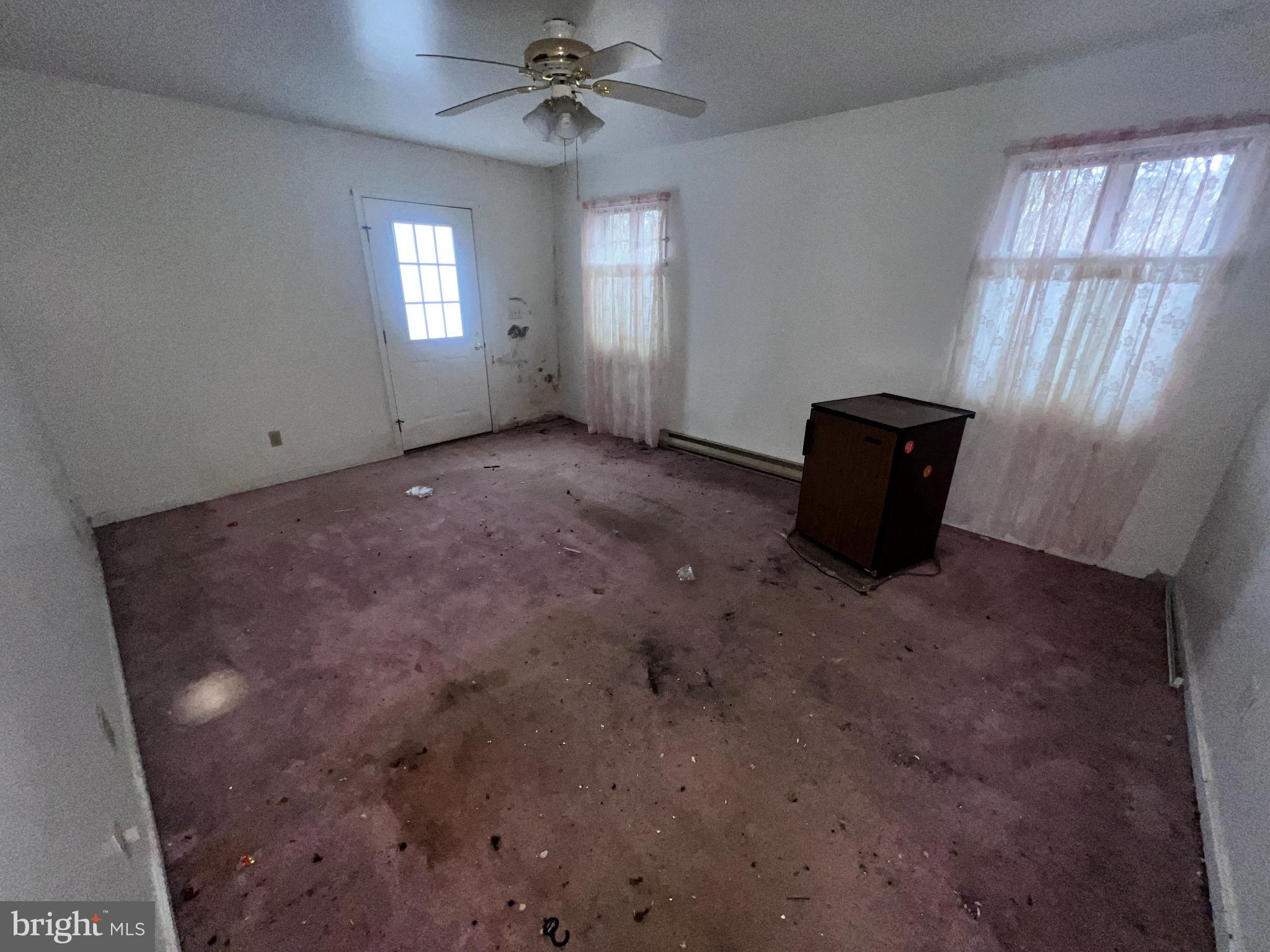 198 Pysell Road McHenry, MD 21541 - Photo 7 of 47 a view of a livingroom with a ceiling fan and window