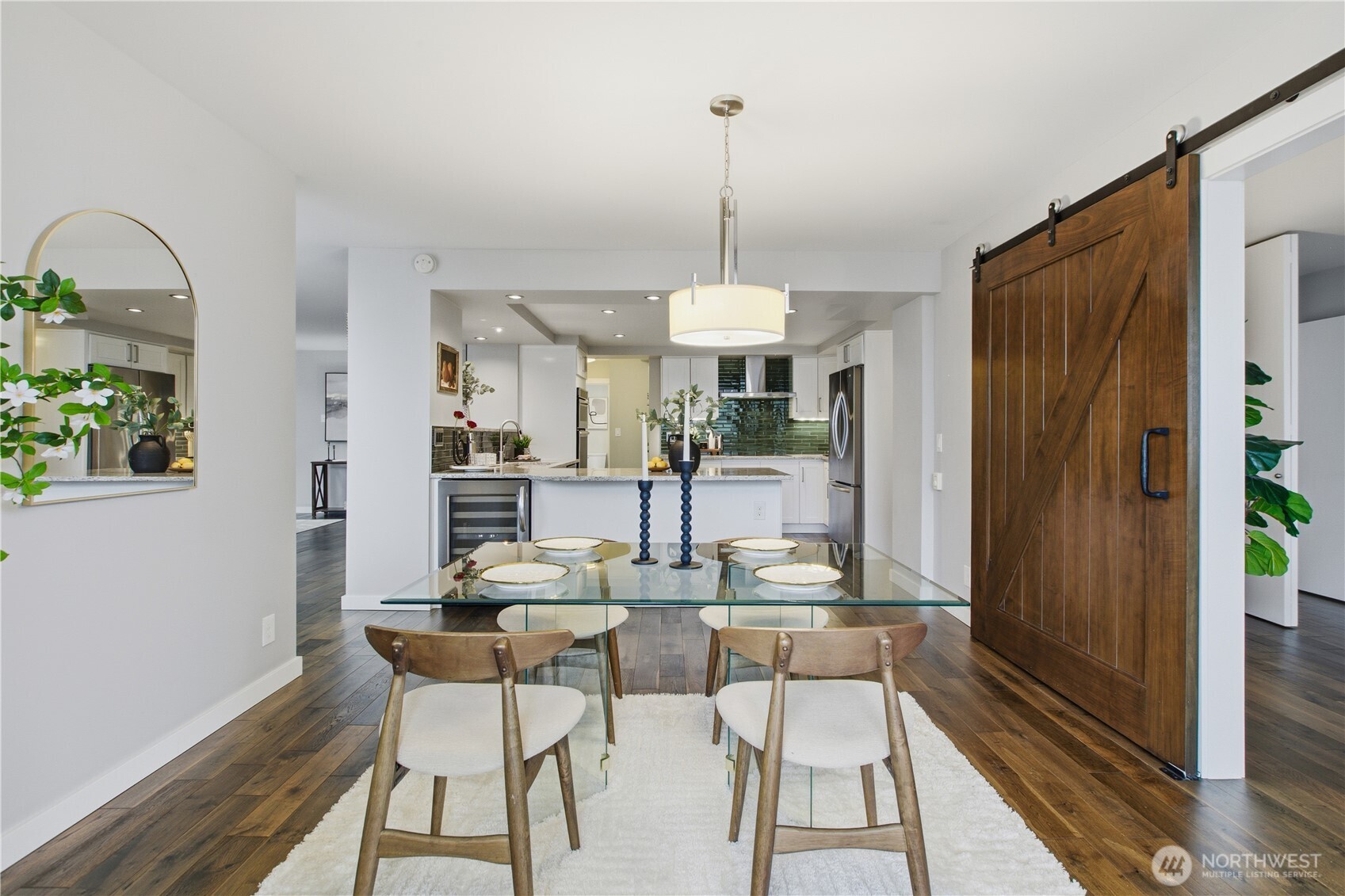 2100 3rd Avenue, Unit 2606 Seattle, WA 98121 - Photo 15 of 37 a dining room with furniture a chandelier and wooden floor
