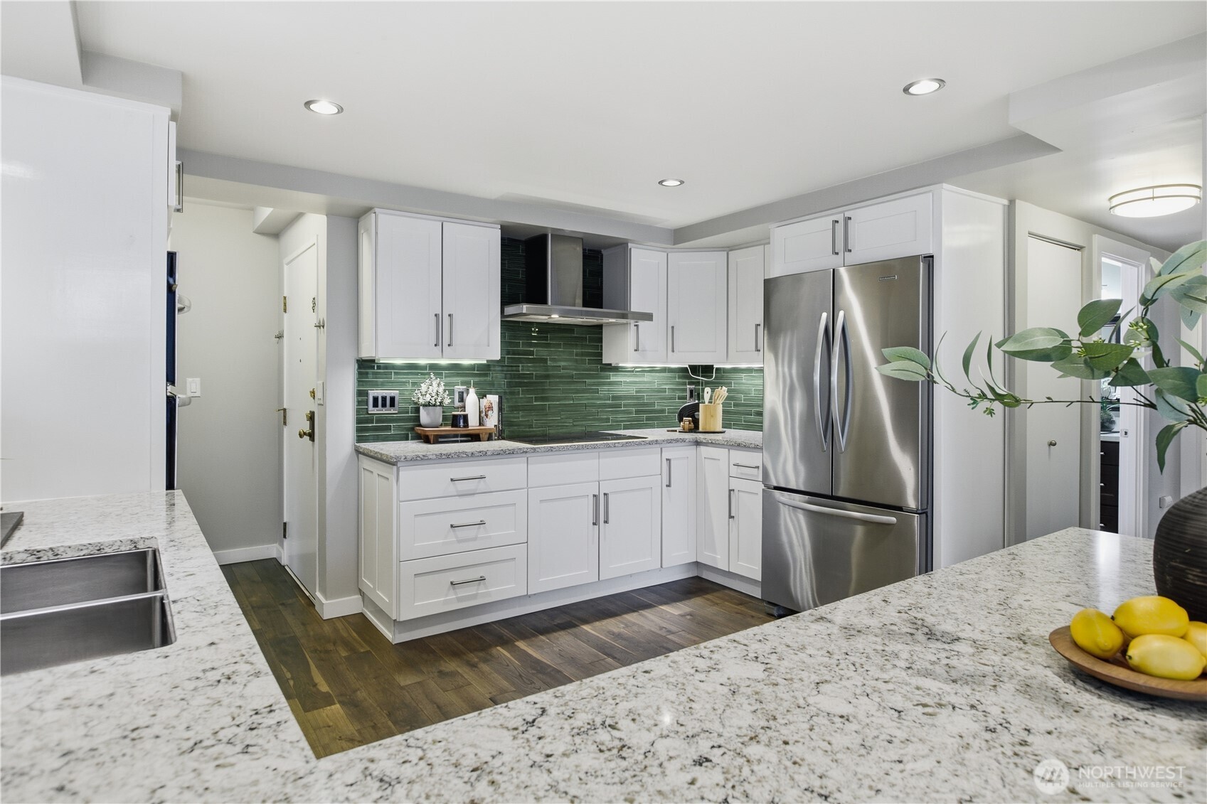 2100 3rd Avenue, Unit 2606 Seattle, WA 98121 - Photo 17 of 37 a kitchen with a refrigerator and a sink