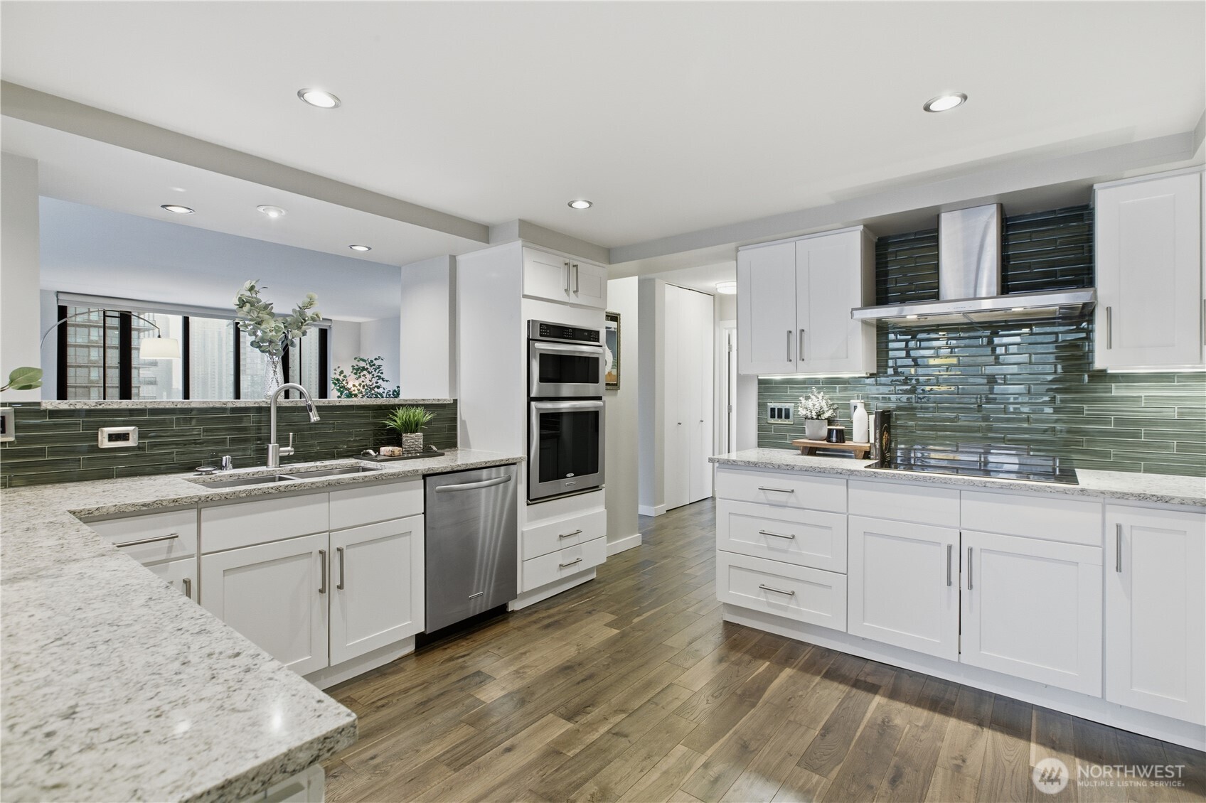 2100 3rd Avenue, Unit 2606 Seattle, WA 98121 - Photo 18 of 37 a kitchen with stainless steel appliances granite countertop a stove and a sink