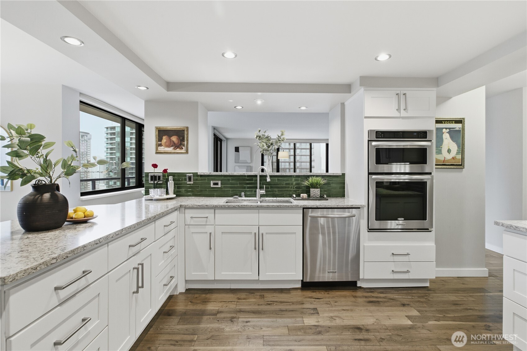2100 3rd Avenue, Unit 2606 Seattle, WA 98121 - Photo 19 of 37 a large kitchen with cabinets a sink and a stove