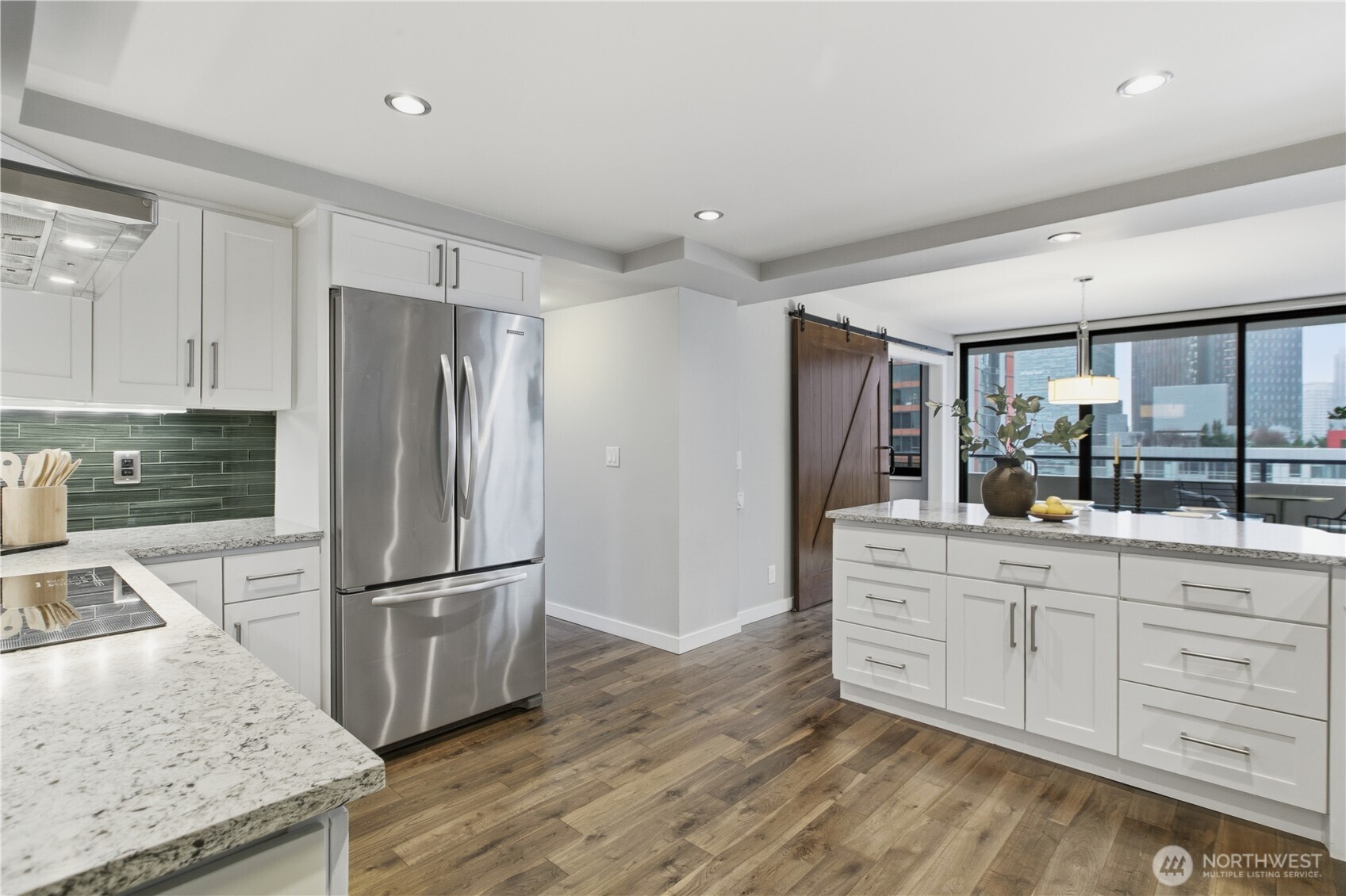 2100 3rd Avenue, Unit 2606 Seattle, WA 98121 - Photo 20 of 37 a kitchen with granite countertop a refrigerator and a sink