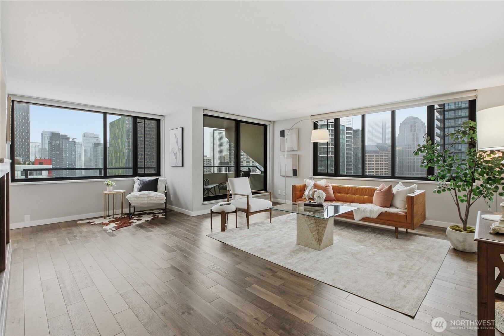 2100 3rd Avenue, Unit 2606 Seattle, WA 98121 - Photo 2 of 37 a living room with furniture and large windows