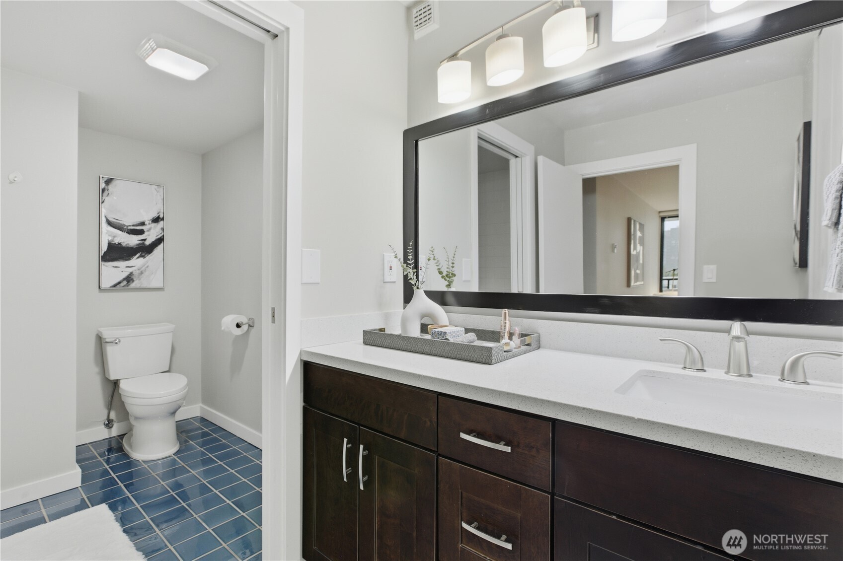 2100 3rd Avenue, Unit 2606 Seattle, WA 98121 - Photo 22 of 37 a bathroom with a sink and a mirror