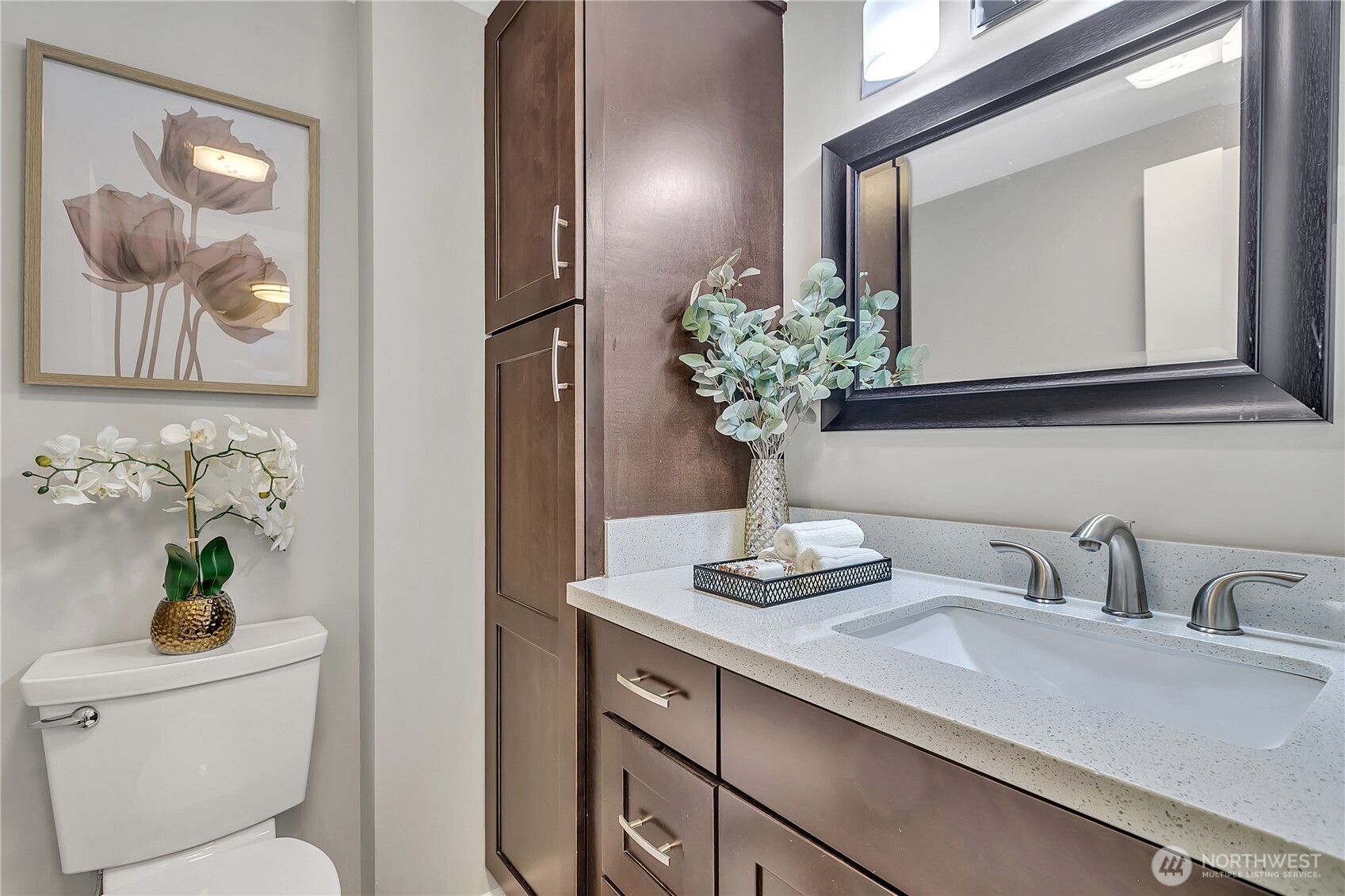 2100 3rd Avenue, Unit 2606 Seattle, WA 98121 - Photo 27 of 37 a bathroom with a sink a toilet and a mirror