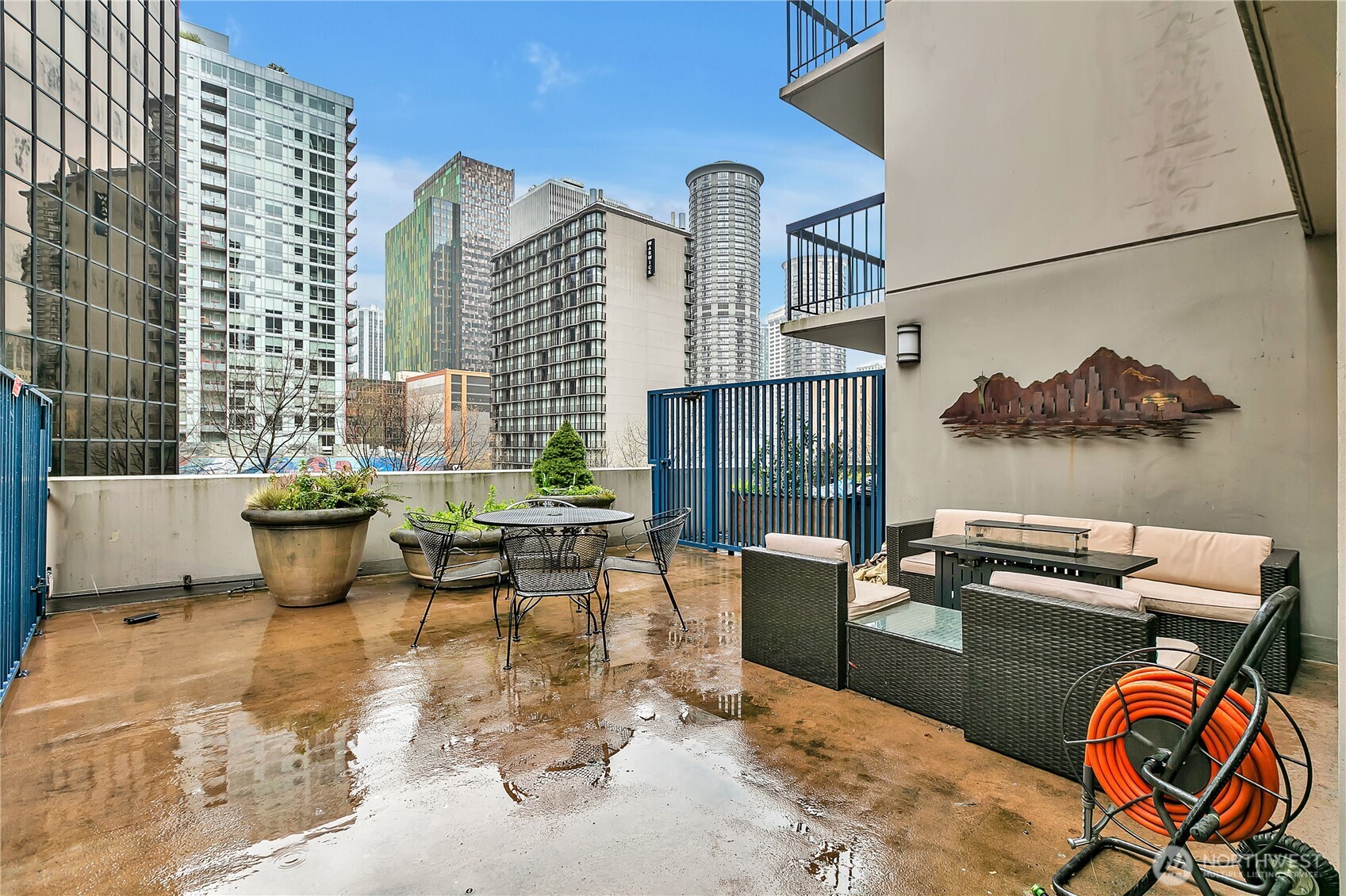 2100 3rd Avenue, Unit 2606 Seattle, WA 98121 - Photo 36 of 37 a view of a patio with couches chairs and a potted plant