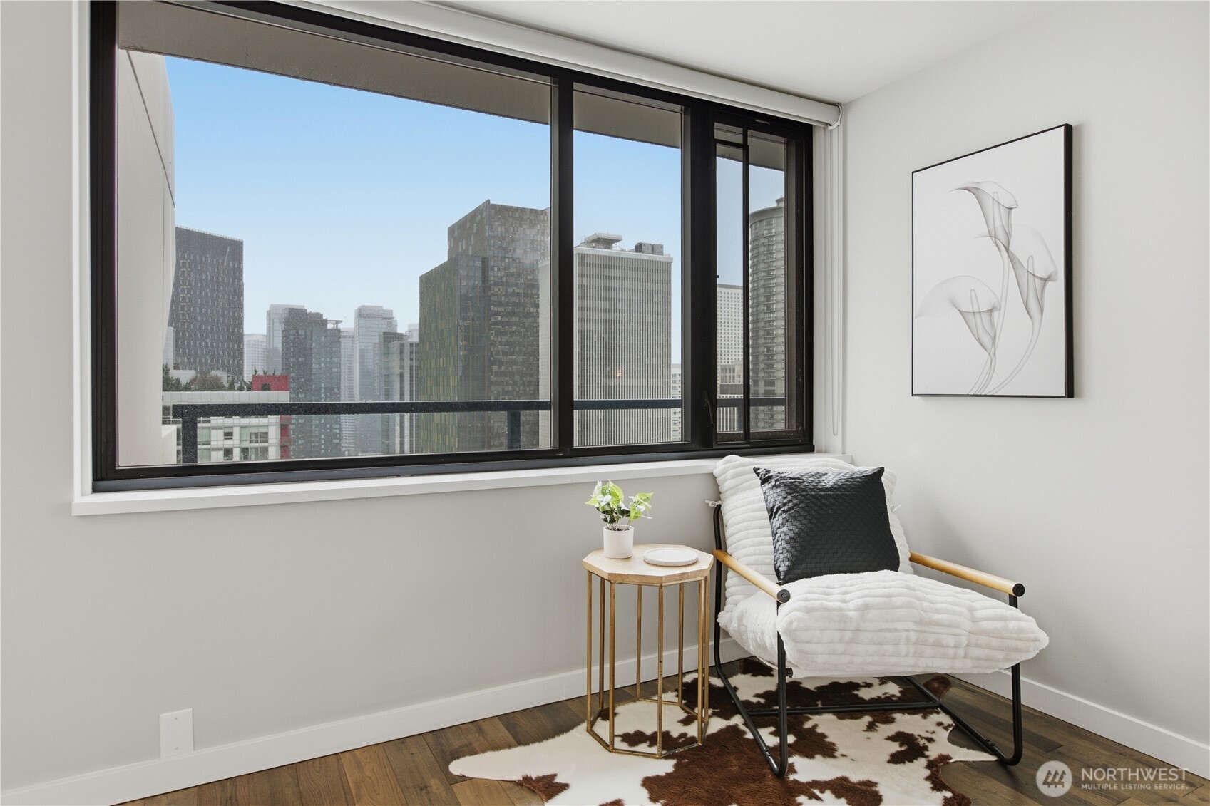 2100 3rd Avenue, Unit 2606 Seattle, WA 98121 - Photo 7 of 37 a living room with furniture and a floor to ceiling window