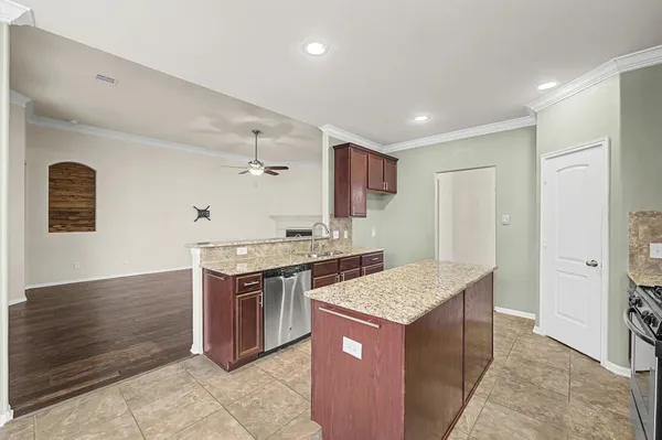 a kitchen with a stove and a sink
