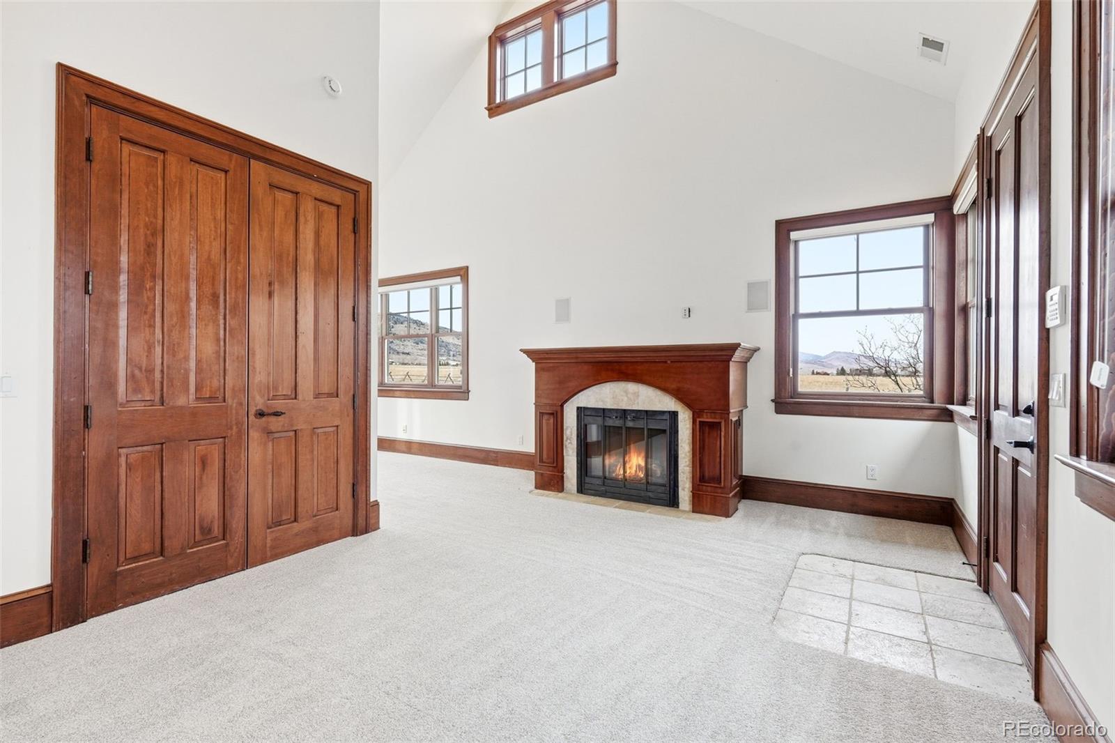 5101 St Vrain Road Longmont, CO 80503 - Photo 28 of 49 a view of an empty room with a fireplace and a window