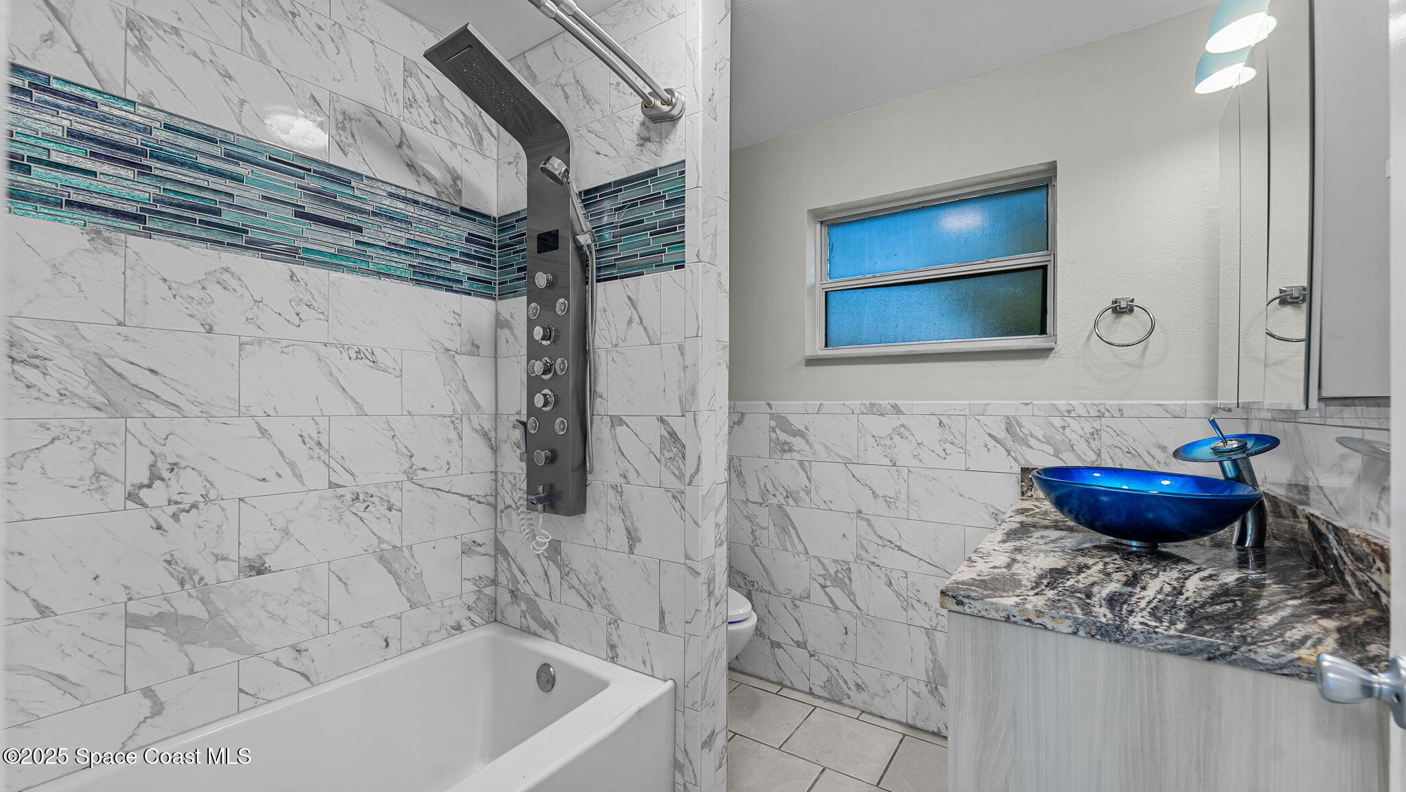 2448 Delaware Drive Melbourne, FL 32935 - Photo 13 of 27 Updated bathroom