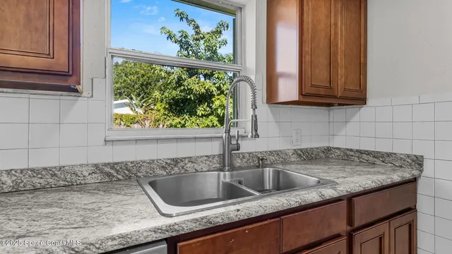 a kitchen with a sink and cabinets