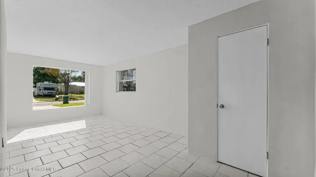 a view of an empty room and window