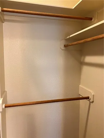 a view of an empty room and a window