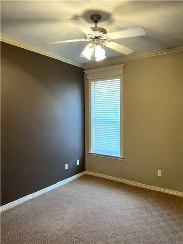 a bathroom with a granite countertop sink and a toilet