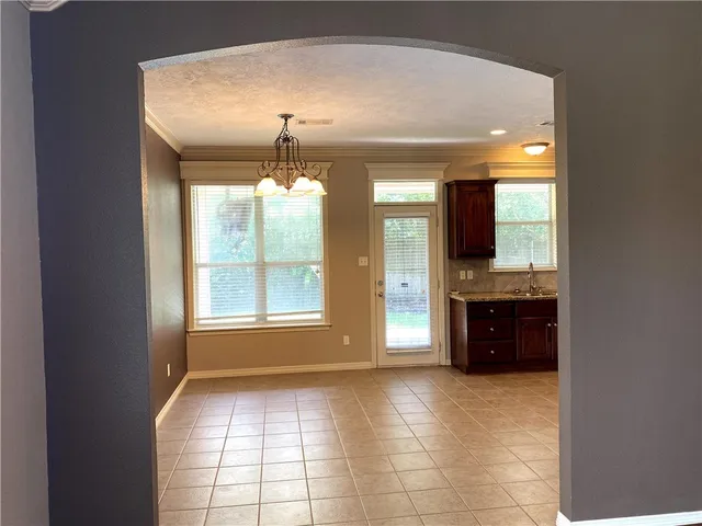 a large kitchen with a large window