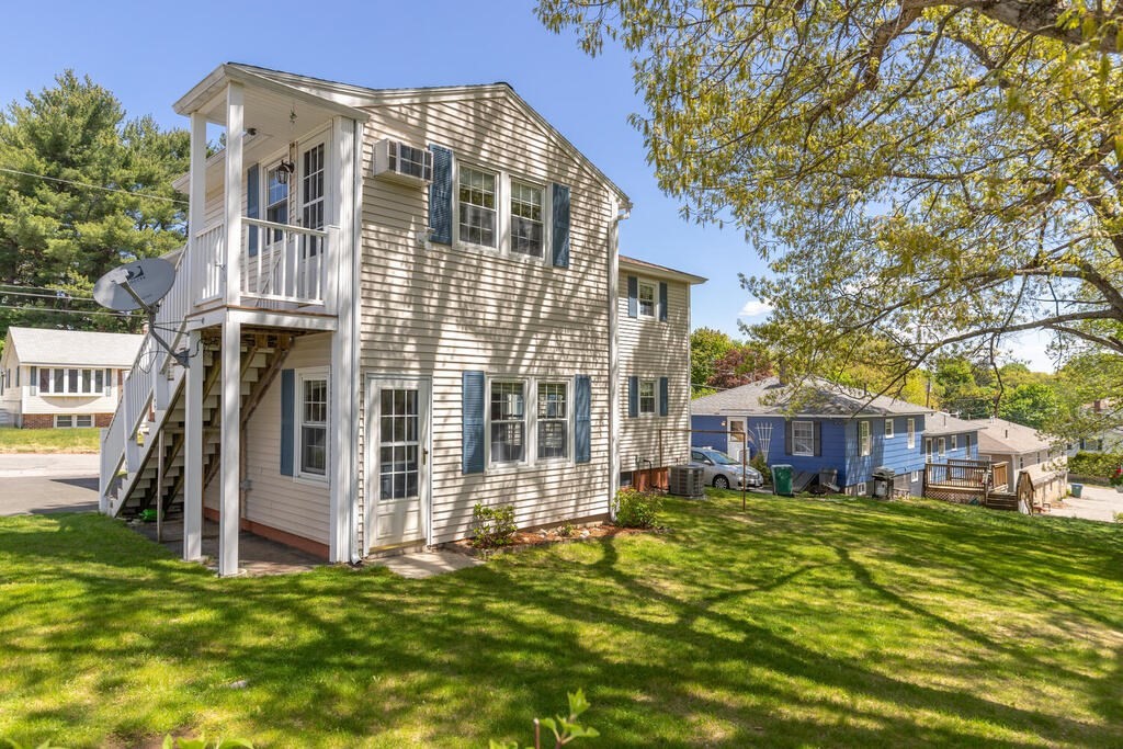 76 Hally Road Lowell, MA 01854 - Photo 33 of 36 a view of a house with a yard