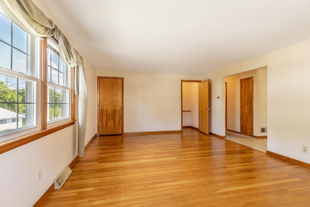 76 Hally Road Lowell, MA 01854 - Photo 7 of 36 a view of an empty room with glass door