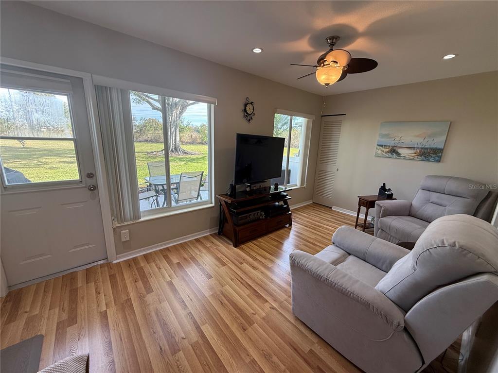 2460 Canadian Way, Unit 22 Clearwater, FL 33763 - Photo 14 of 42 a living room with furniture and a flat screen tv