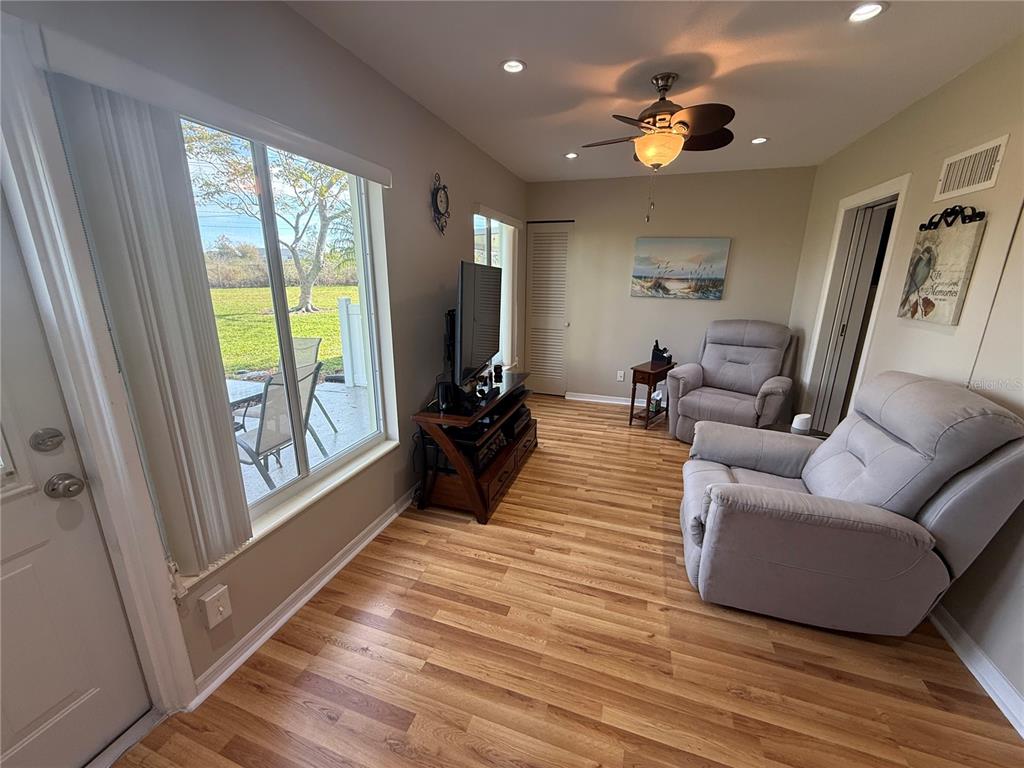 2460 Canadian Way, Unit 22 Clearwater, FL 33763 - Photo 15 of 42 a living room with furniture and a large window