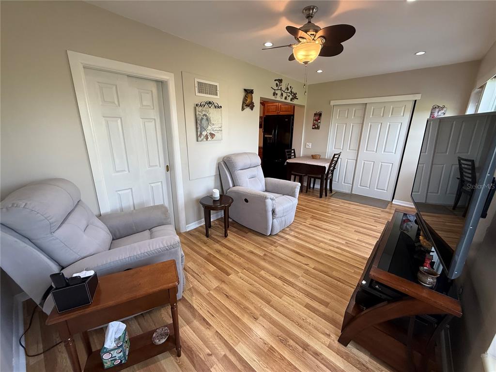 2460 Canadian Way, Unit 22 Clearwater, FL 33763 - Photo 16 of 42 a living room with furniture and a flat screen tv