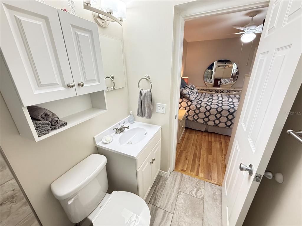 2460 Canadian Way, Unit 22 Clearwater, FL 33763 - Photo 22 of 42 a bathroom with a sink toilet and shower