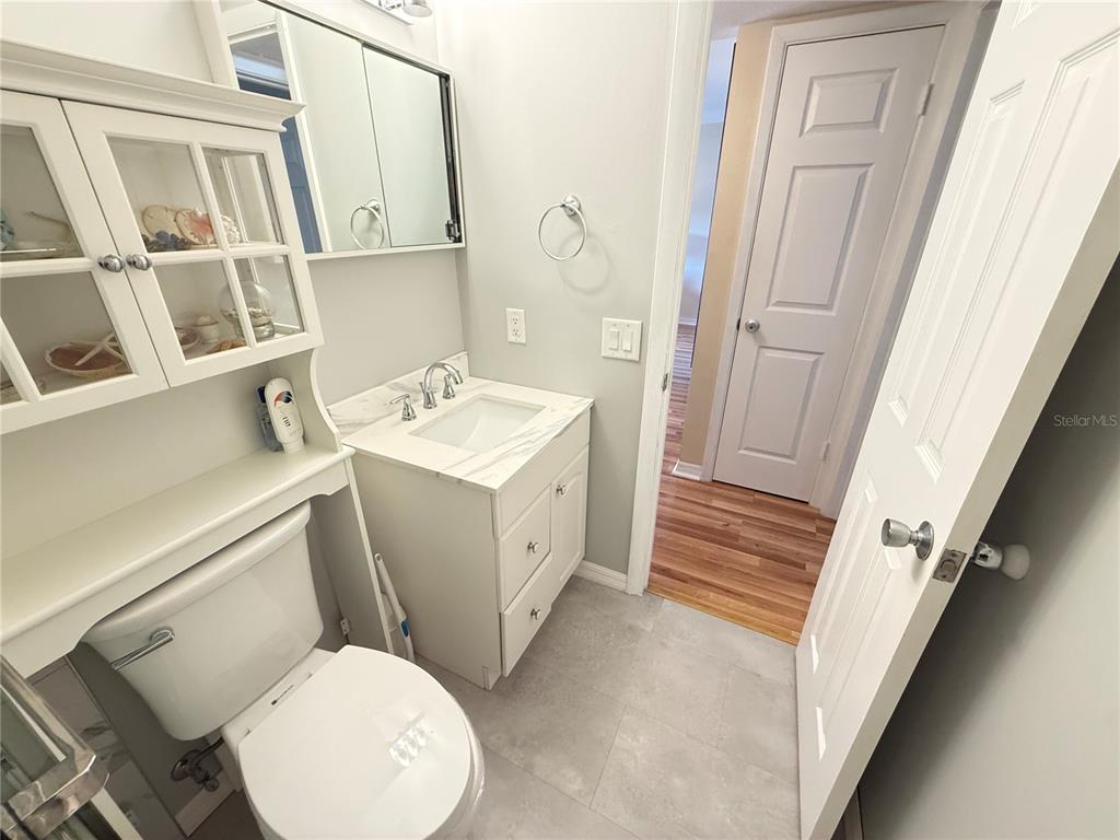 2460 Canadian Way, Unit 22 Clearwater, FL 33763 - Photo 25 of 42 a bathroom with a sink toilet and tub