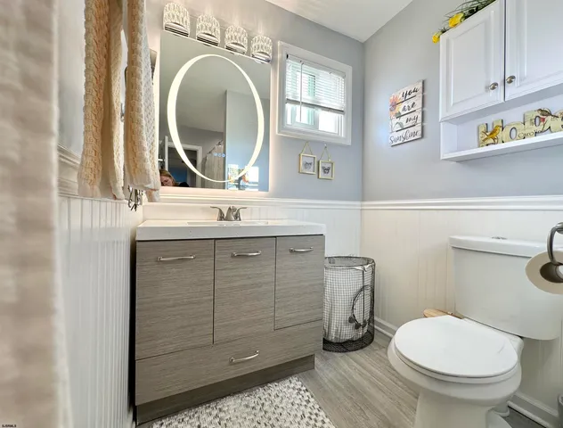a living room with furniture and a mirror