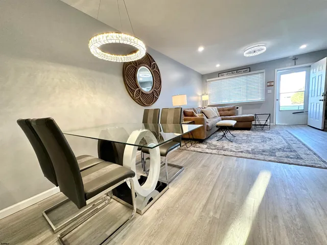 a view of a house with a door and wooden floor