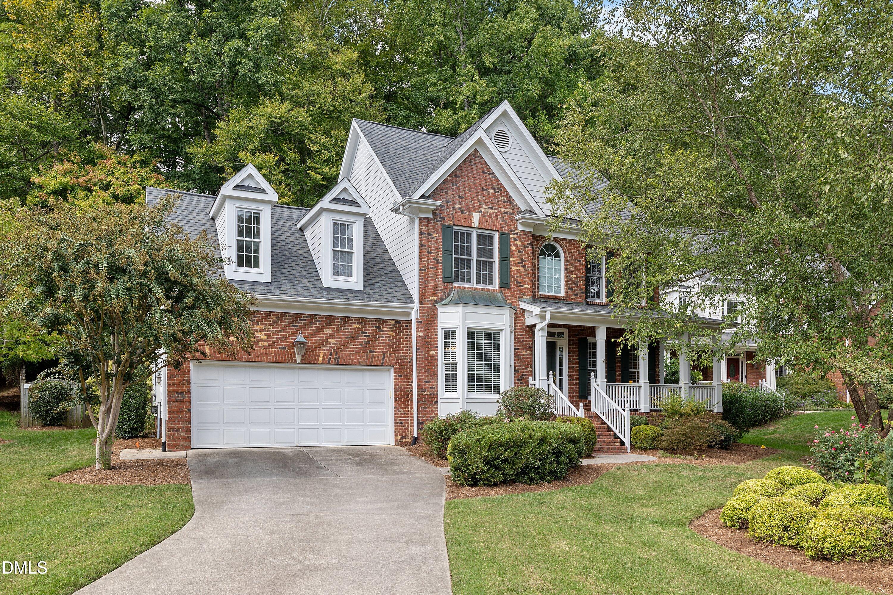 3914 Sterling Ridge Lane Durham, NC 27707 - Photo 2 of 66 Brick exterior with white siding accents and a gray roof